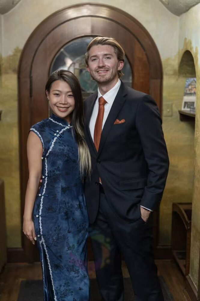 Lina in a blue qipao and Michael in a suit